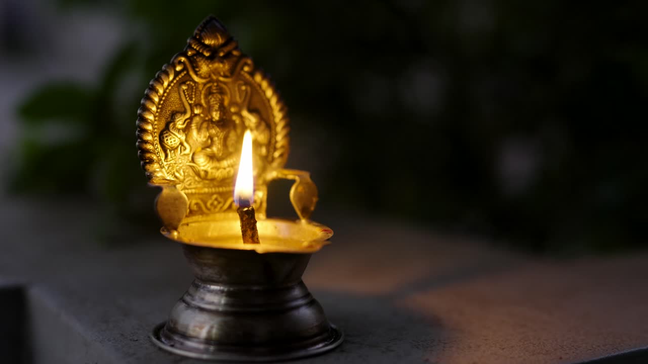 Silver Pooja Diya with Matchstick, Silver Pooja Diya Glowing with Flame – Hindu Religious Ritual, Spiritual Prayer, and Traditional Worship Concept