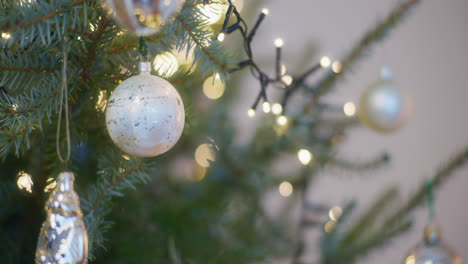 warmth of christmas home woman decorates christmas tree