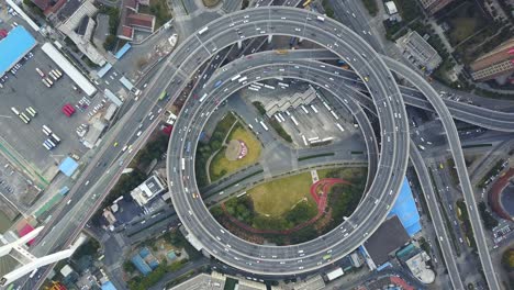 nanpu bridge in shanghai china nanpu da qiao cable-stayed bridge aerial footage top down of passing traffic on elevated circular on off ramp 4k