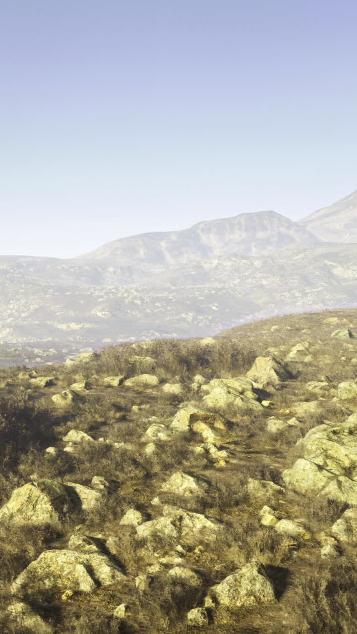 Stunning natural landscape with rocky terrain and distant mountains in daylight