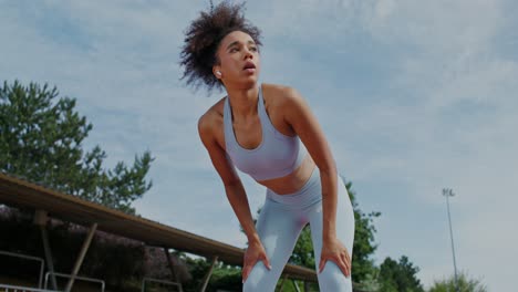 woman taking a break from running