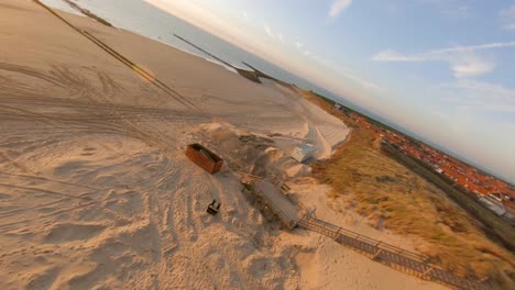 drone flying above the dunes showing the construction for the next touristic season