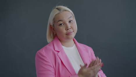 woman in pink blazer