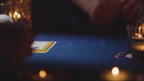 close up of woman giving tarot card reading to man on candlelit table 6