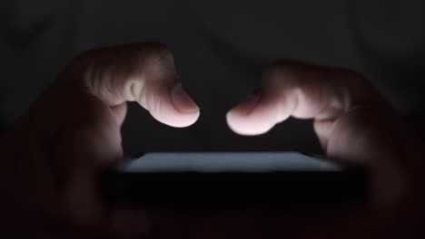 person using a smartphone at night
