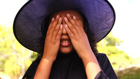 girl pretending to be a witch