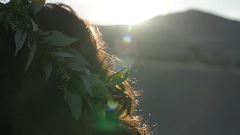 close up of a beautiful crown of leaves on the head of a bride on a bright summer day