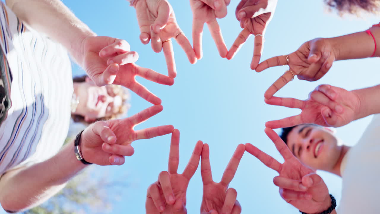 Group of People Making Peace Signs