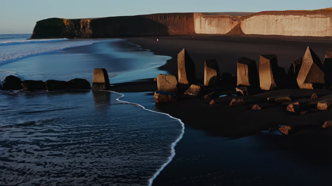 Dramatic Black Sand Beach with Basalt Columns and Cliffs in Iceland