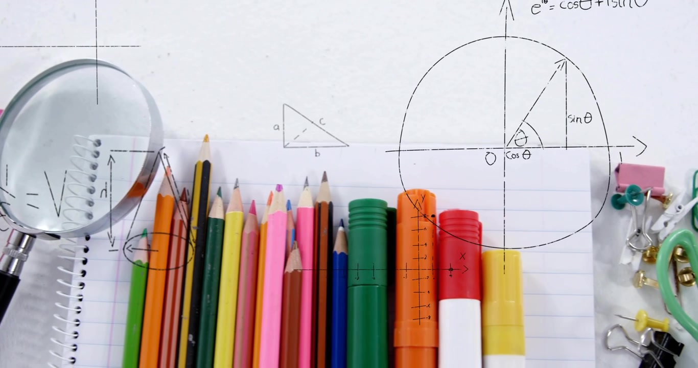 Camera panning right as magnifying glass slides over pencils and notebook, revealing math diagrams