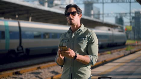 man waiting for train at station