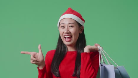 woman in santa hat shopping