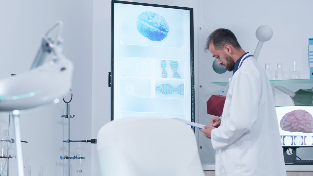 Doctor analyzing brain scan and DNA on monitor in clinic