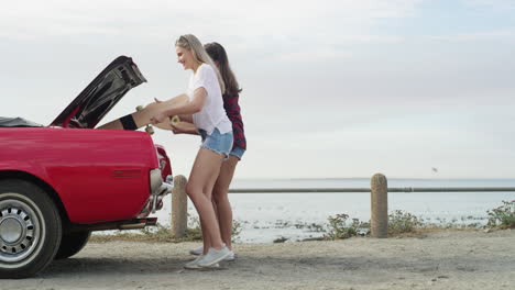 two attractive young women stopping for a quick