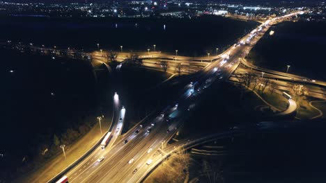 Illuminated-road-intersection-at-night-in-Warsaw,-Poland