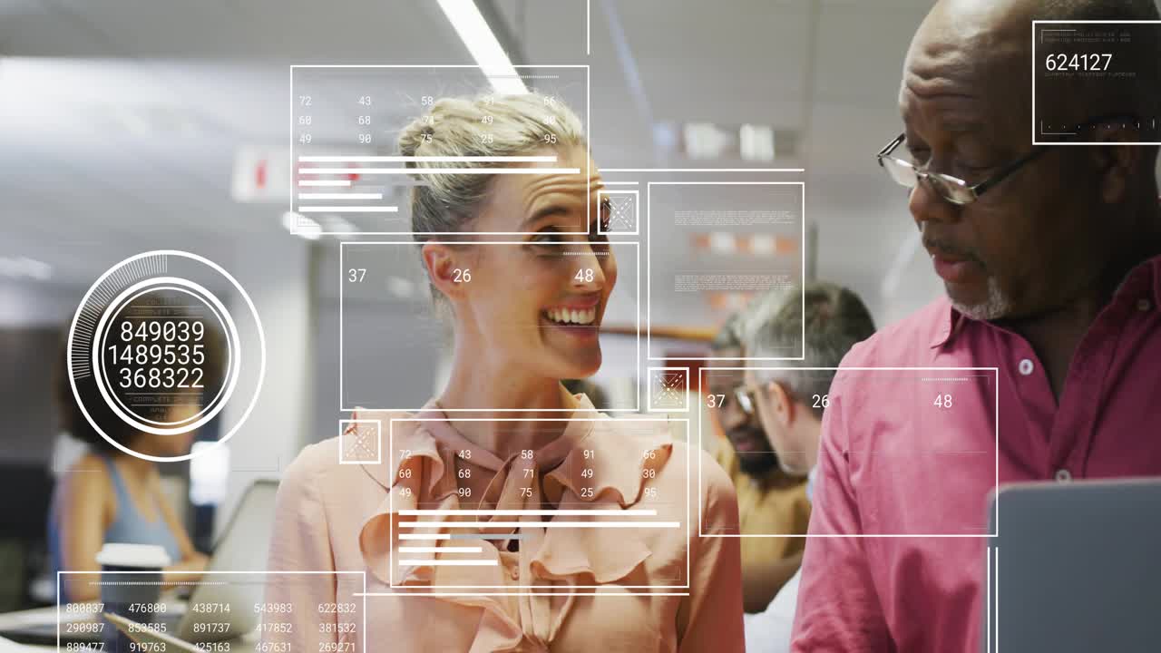 Colleagues pointing and tapping on devices in office showing overlays, charts for business analysis
