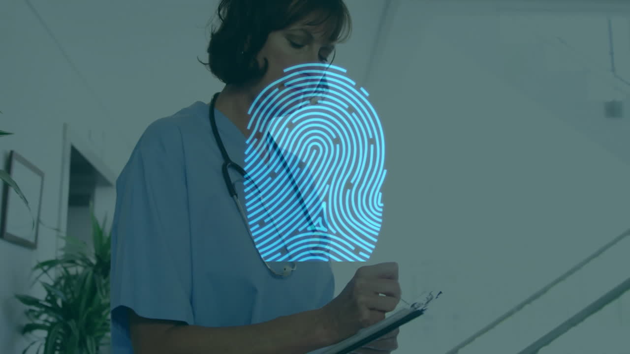 Writing on clipboard, healthcare professional in blue scrubs in hospital setting