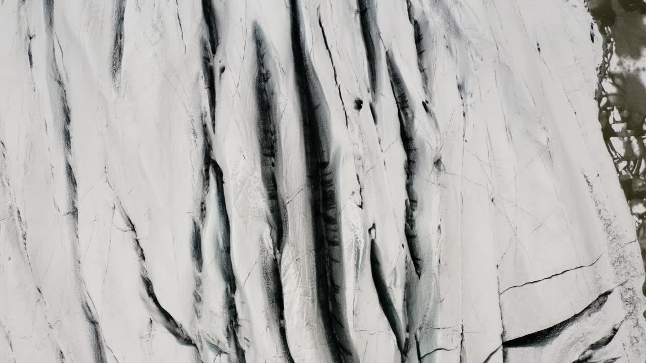 Drone View Tilt-up Reveal of Majestic Snow-Covered Svinafellsjokull Glacier in Iceland