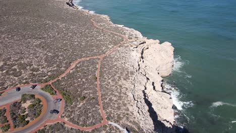 drone aerial pan down over natural bridge and castle rock in kalbarri