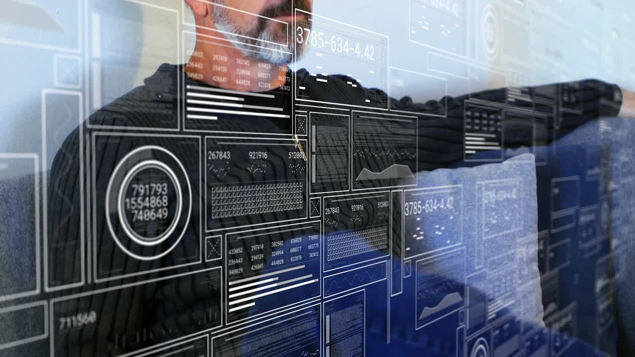 Man sitting on couch seeing tech panels appearing then swiping through graphs updating for analysis