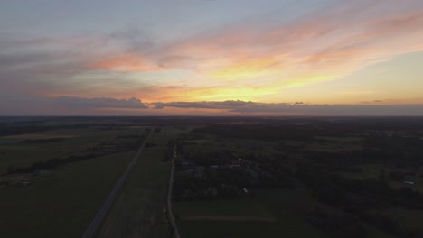 Colorful-Sunset-Sky-Over-Rural-Area-And-Road-Late-In-The-Evening