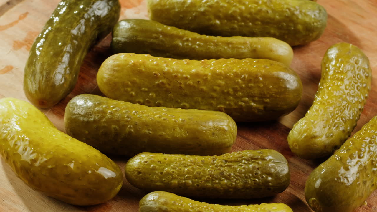 Pickled Cucumbers on Wooden Board