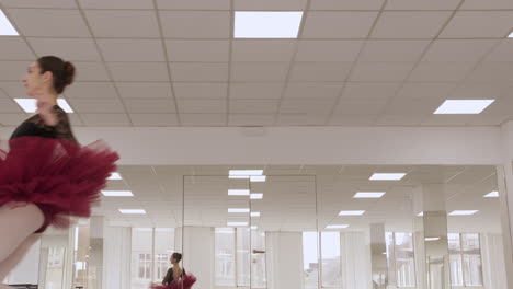 Professional-ballerina-jumping-in-and-off-screen-in-a-white-dance-studio-with-mirrors