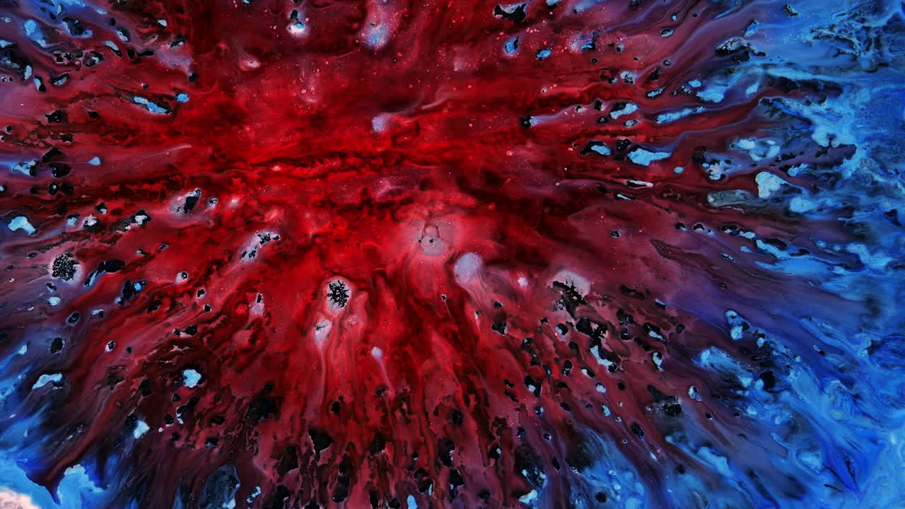 Explosion. A blooming flower. Fluid art. The expansion effect. The drop flies apart.