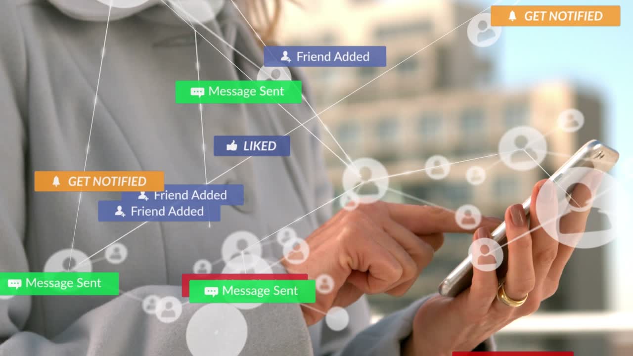 Animation of media icons over caucasian businesswoman using smartphone