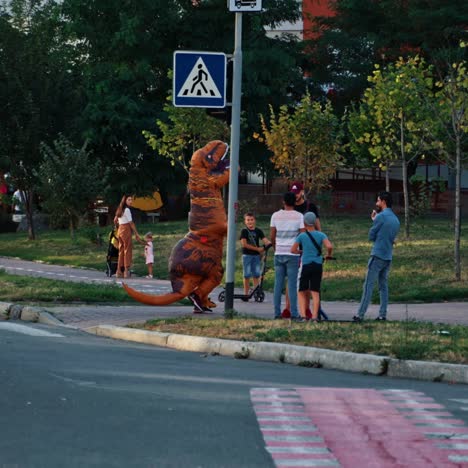 unrecognizable person in dinosaur costume
