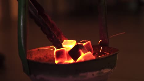 close up of burning charcoal cube for shisha