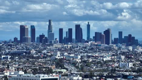 los angeles, downtown with city sprawl and traffic in foreground