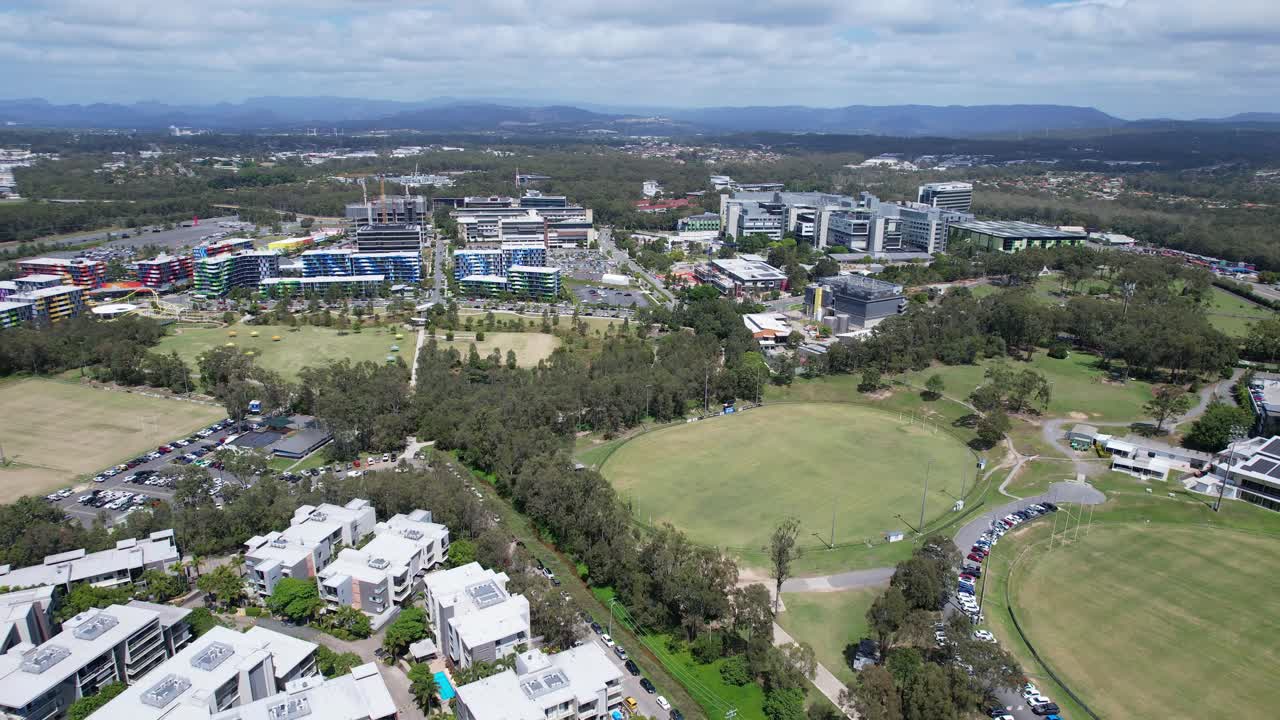 Apartment Complex Buildings Near Southport Sharks Open Fields In Musgrave Avenue, Southport QLD Australia. Aerial Drone Shot