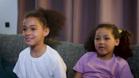 kids watching film at home