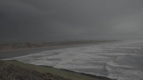 stunning landscape in the coast of devon england uk. wild sea with lot of waves and beach in the distance