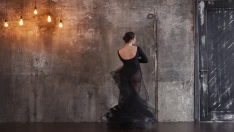 woman dancing in a black dress