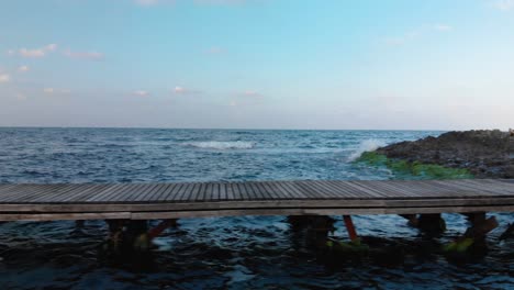 Panning-shot-of-small-wooden-pier,-camera-move-along-the-pier---Lozenets,-Bulgaria-1