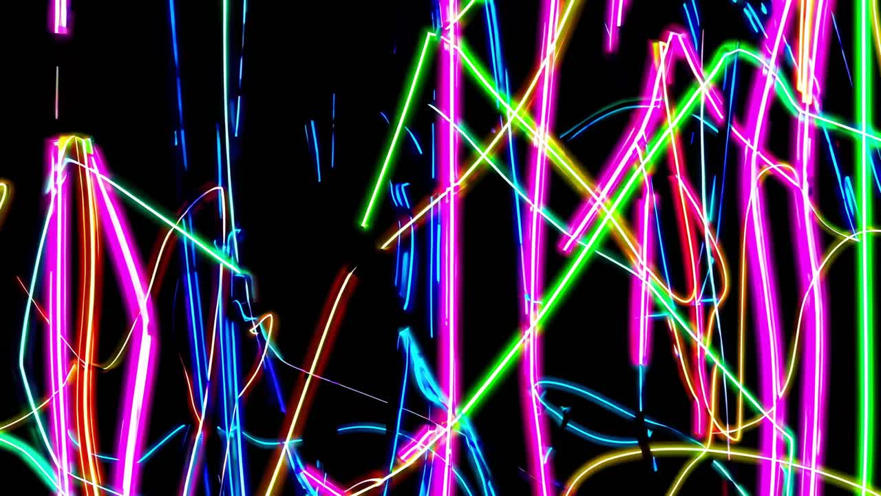 Colorful neon lights are intersecting, creating a vibrant and energetic abstract pattern against a stark black background, evoking a sense of dynamic movement and visual excitement