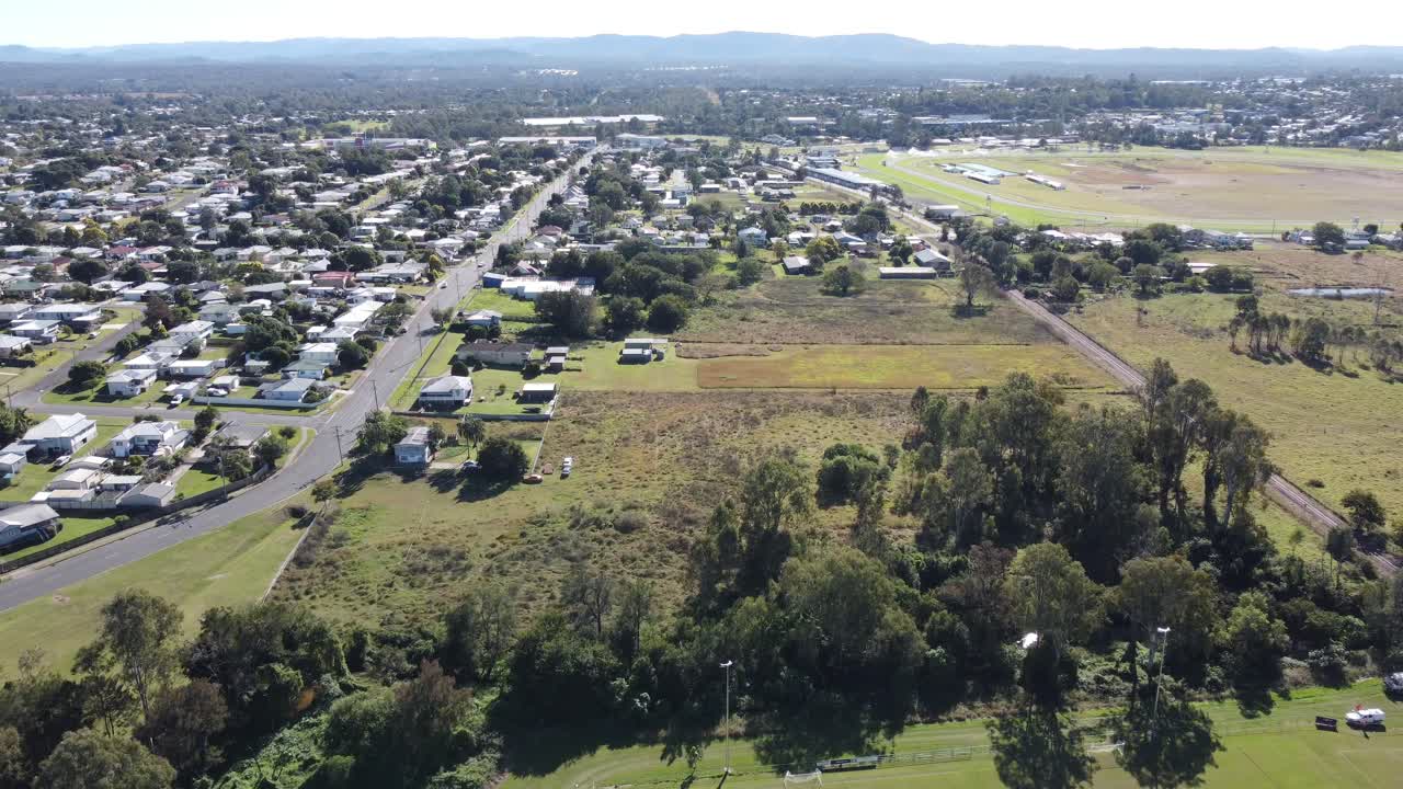 4K aerial view of a suburb with large backyards in Ipswich a small regional town in Australia