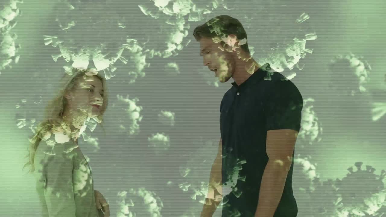 цифровое композитное видео клеток covid-19, движущихся против пары, сражающейся в фоновом режиме