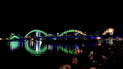 standing and looking at the bridge in da nang