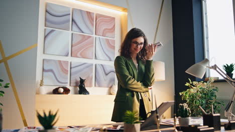 businesswoman recording audio message smartphone at office. woman talking phone