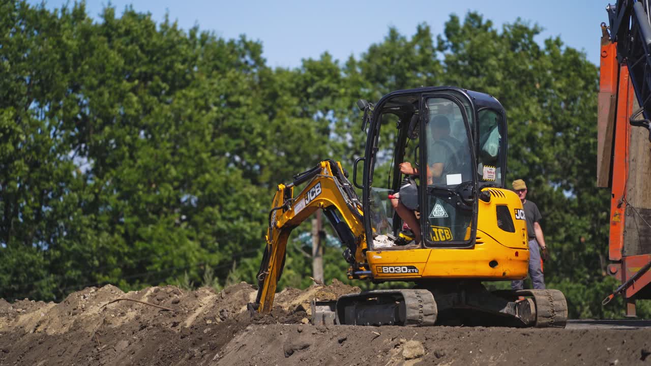 New road construction. Constructions worker working on road