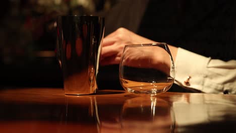 sequence of a bartender pouring and serving a beverage