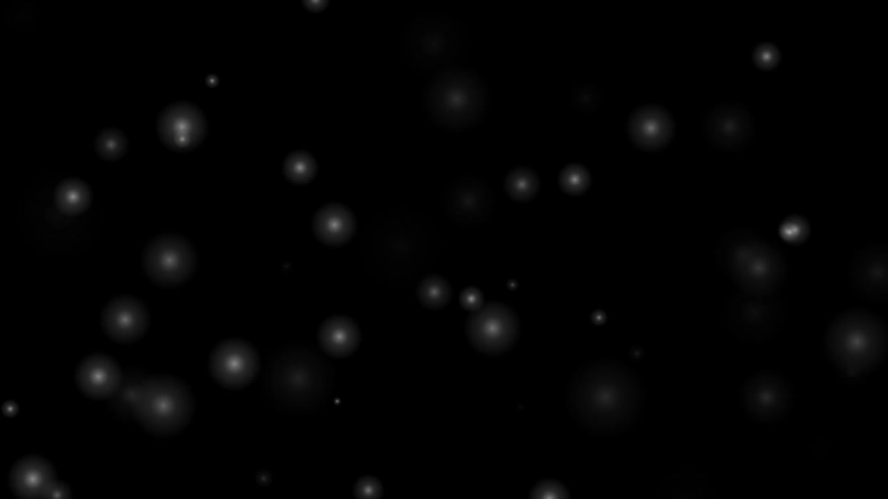 Floating White Glowing Particles on Black Background