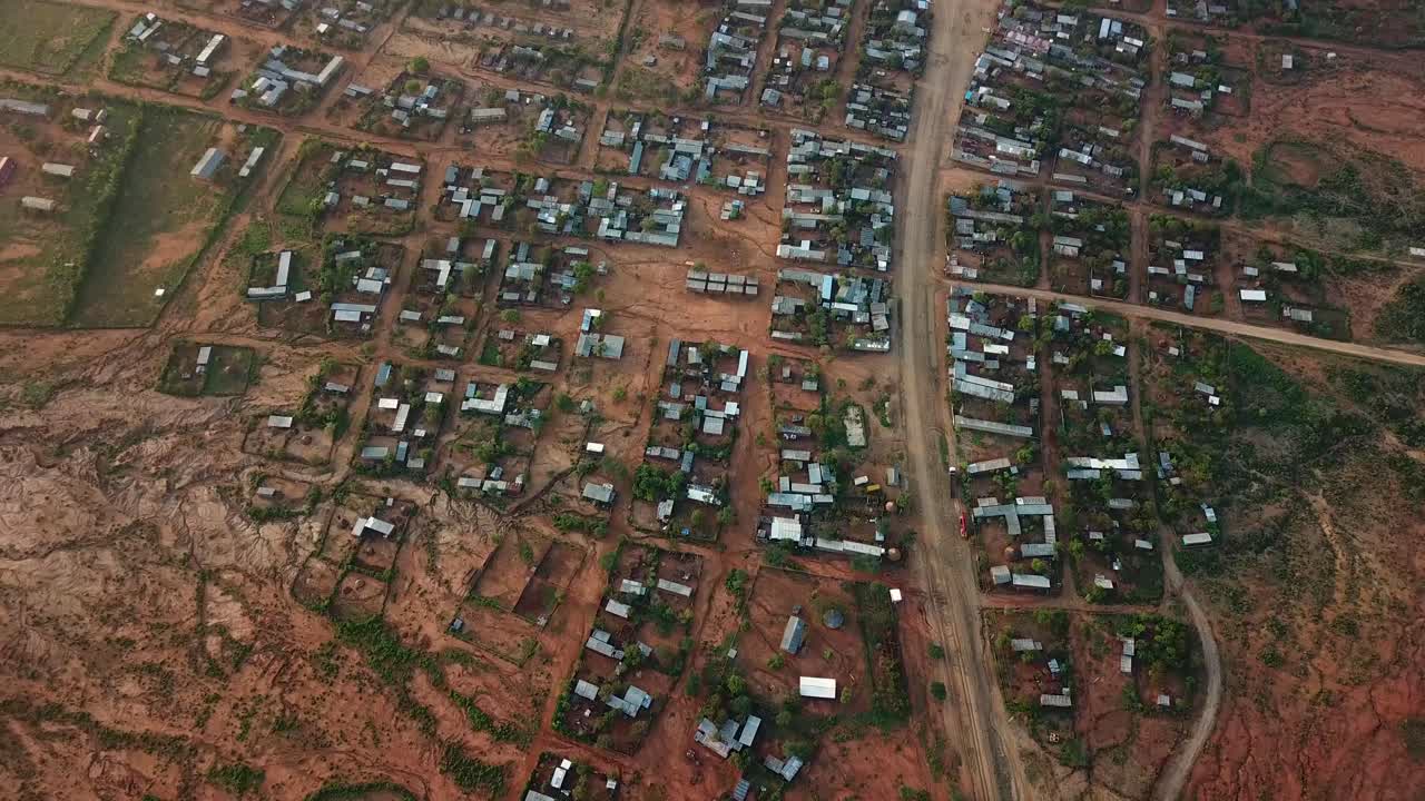 Large remote town in the middle of Ethiopia, buildings with metalic roofs, aerial urbanism scene from Africa