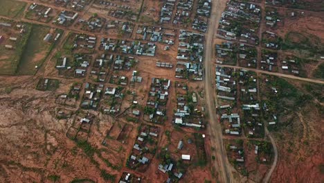 large remote town in the middle of ethiopia, buildings with metalic roofs, aerial urbanism scene from africa