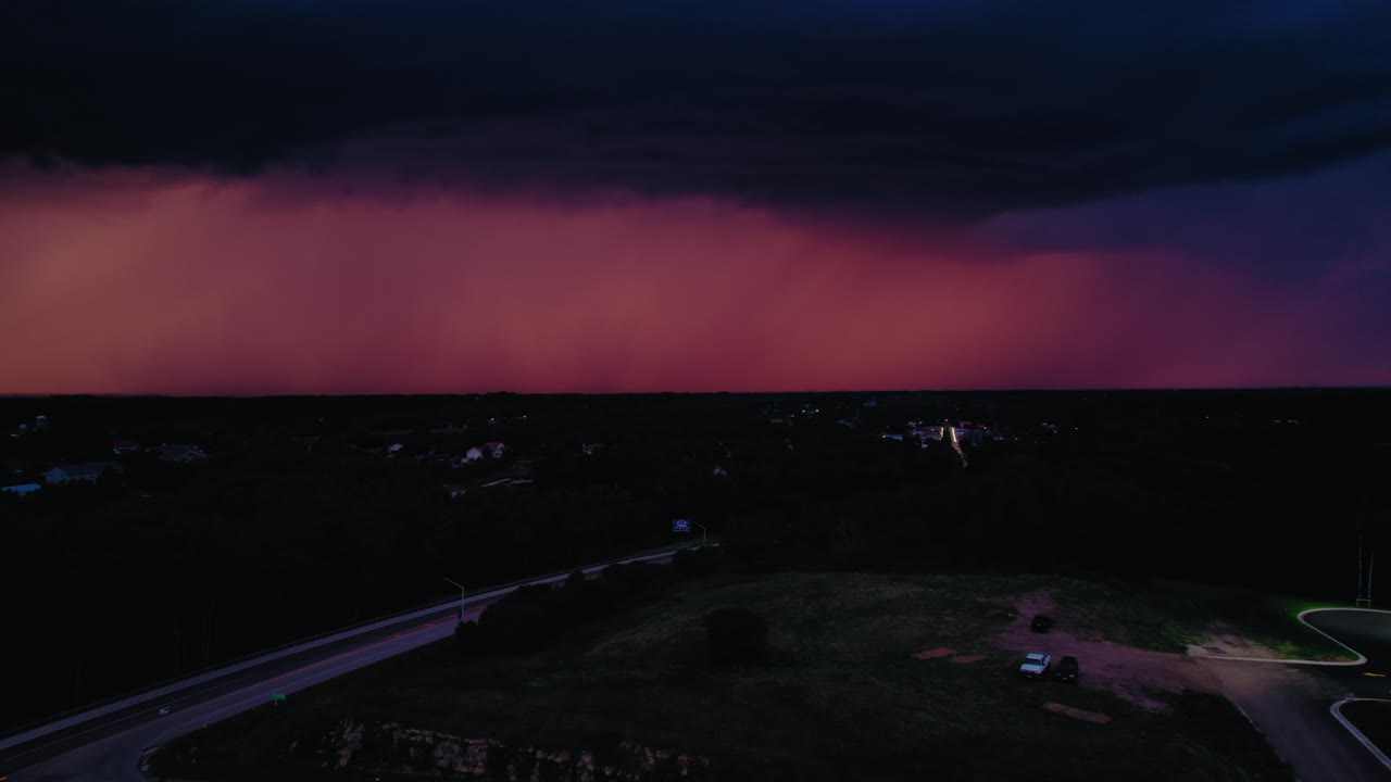 Powerful conceptual drone shot of a single bolt of electricity hitting the ground, representing shock, power, or destiny