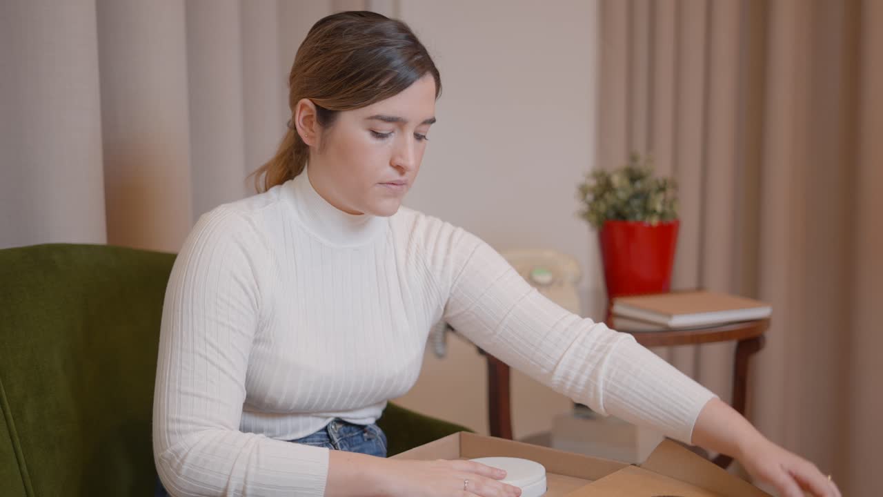 Woman Unboxing a Product at Home