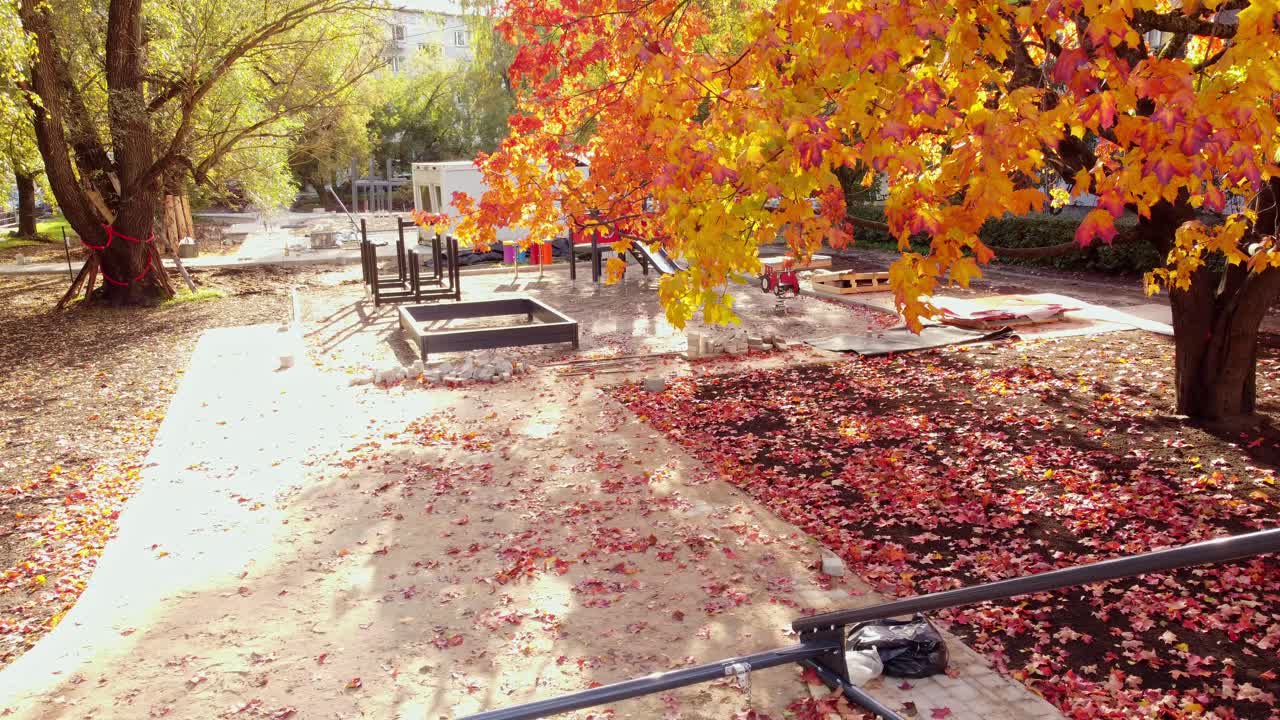 Aerial trucking pan reveal of playground development site in Latvia, featuring new urban infrastructure and residential zones